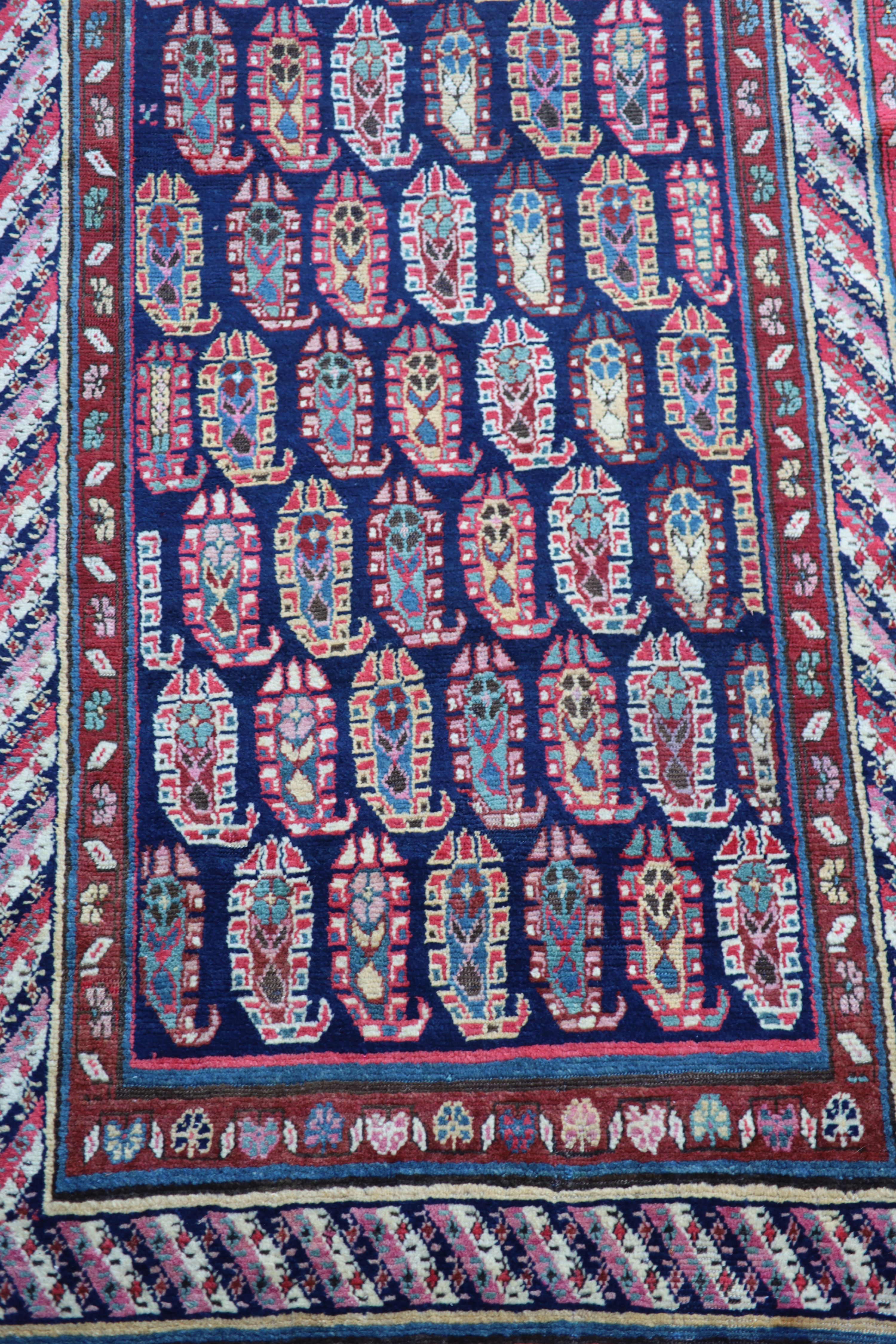 An antique Karabagh blue ground runner, late 19th century 355 x 106